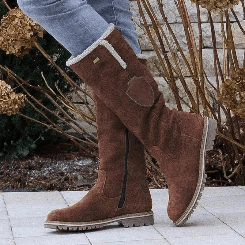 Stylish women's insulated winter boots. Warm, cozy, and perfect for snow. Non-slip comfort footwear for cold weather.
