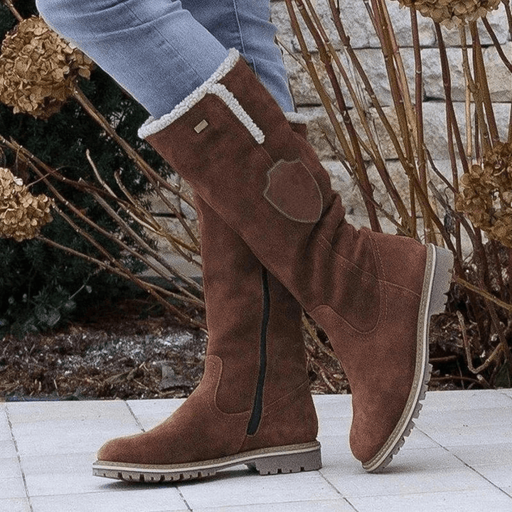 Stylish women's insulated winter boots. Warm, cozy, and perfect for snow. Non-slip comfort footwear for cold weather.