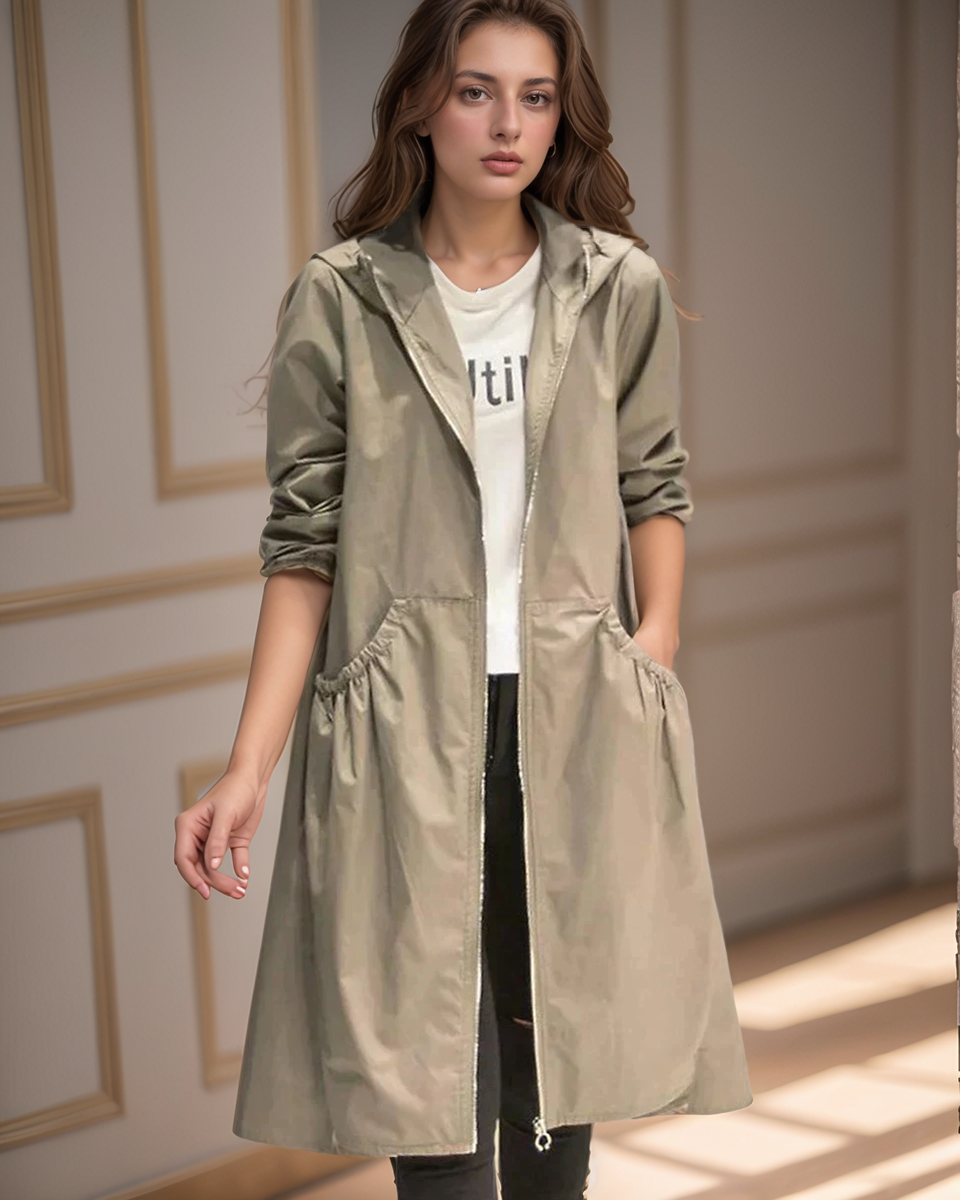 Stylish women's knee-length waterproof hooded raincoat for all-weather protection and casual wear.