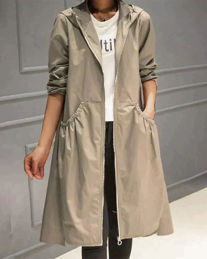 Relaxed fit waterproof women's raincoat with hood, ideal for spring & autumn, lightweight & stylish.