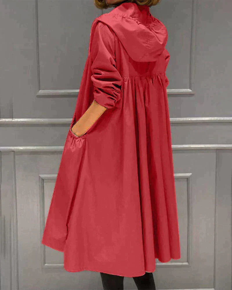 Women's hooded waterproof raincoat, knee-length & relaxed fit, great for active outdoor and casual wear.
