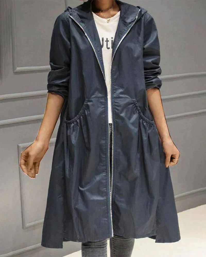 Elegant women's knee-length hooded waterproof jacket, an essential stylish and versatile all-weather raincoat.