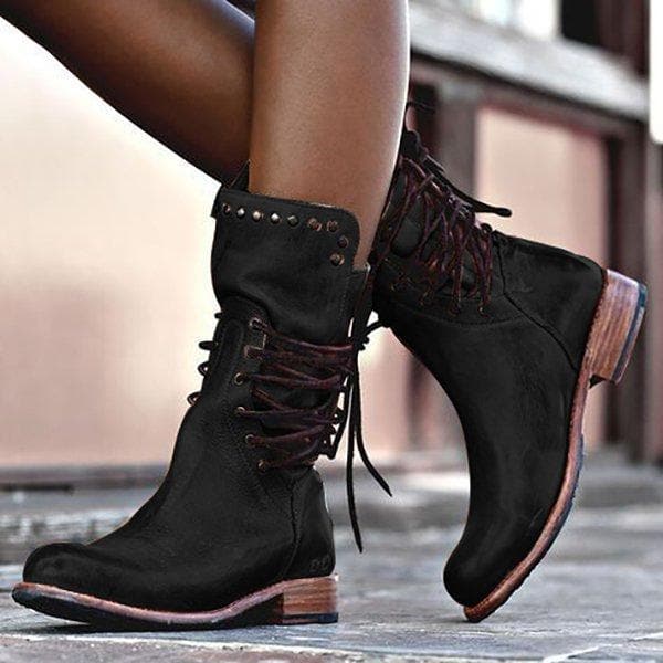 Fashionable women's lace-up ankle boots featuring edgy studs & a practical low heel. Ideal for winter comfort.