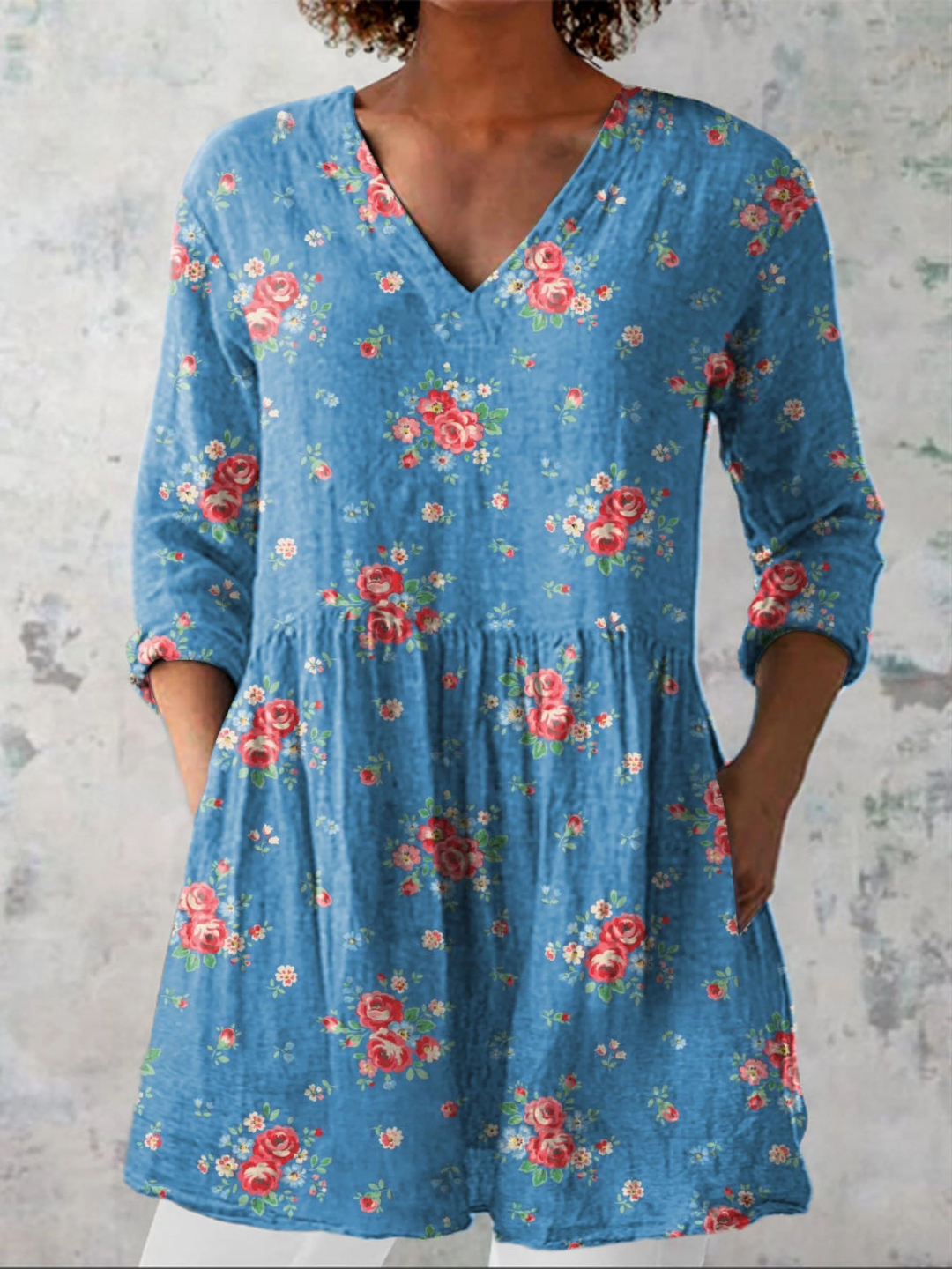 Stylish Women's long blue V-neck blouse with a flowing, relaxed fit, perfect for versatile everyday wear.