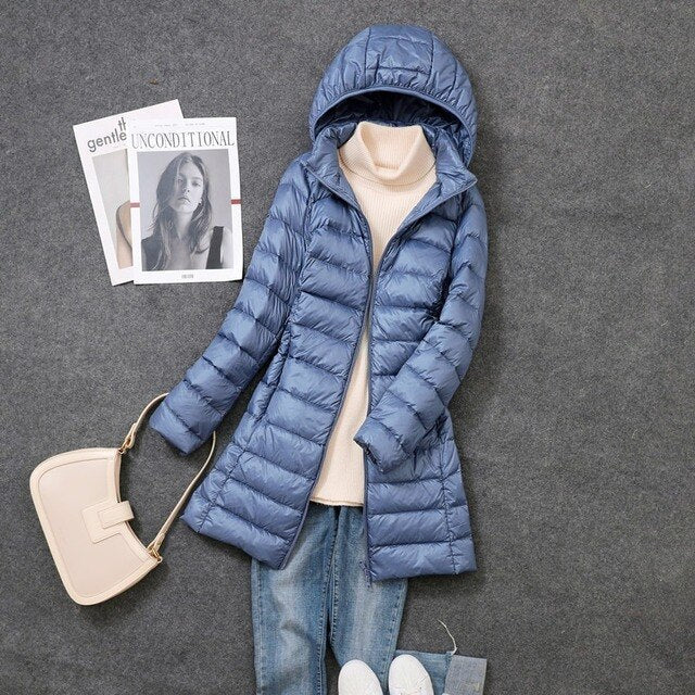 Women's long puffer jacket featuring a convenient detachable hood, ensuring warmth and style for cold weather.