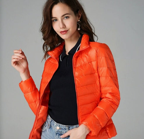 Stylish women's long-sleeve quilted puffer jacket, perfect warm winter coat for fall fashion. Cozy outerwear.