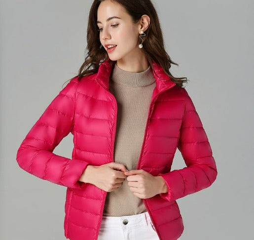 Warm women's puffer jacket with chic quilted design. Long-sleeve winter coat for cozy and stylish outerwear.