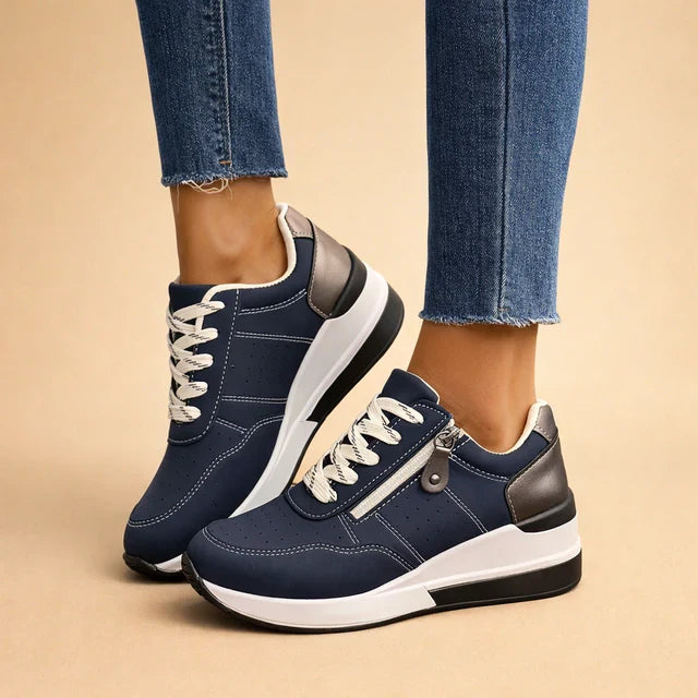 Chic women's low-top sneakers, perforated for breathability, cushioned for comfort. Perfect for spring & summer fashion.