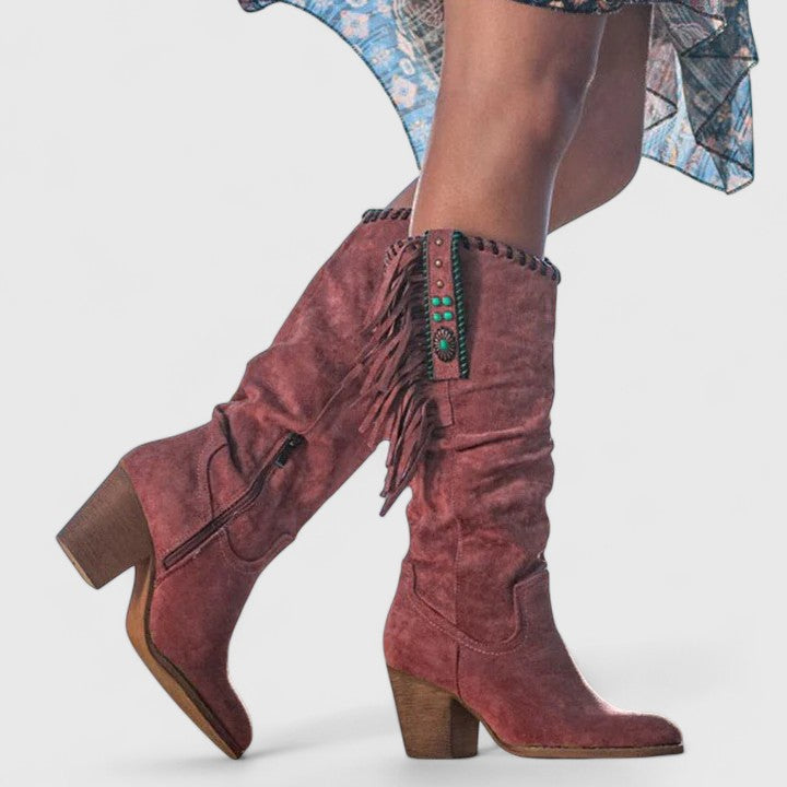 Chic mid-calf women's boots with flowing fringe and a practical block heel, enhancing any fashion outfit.