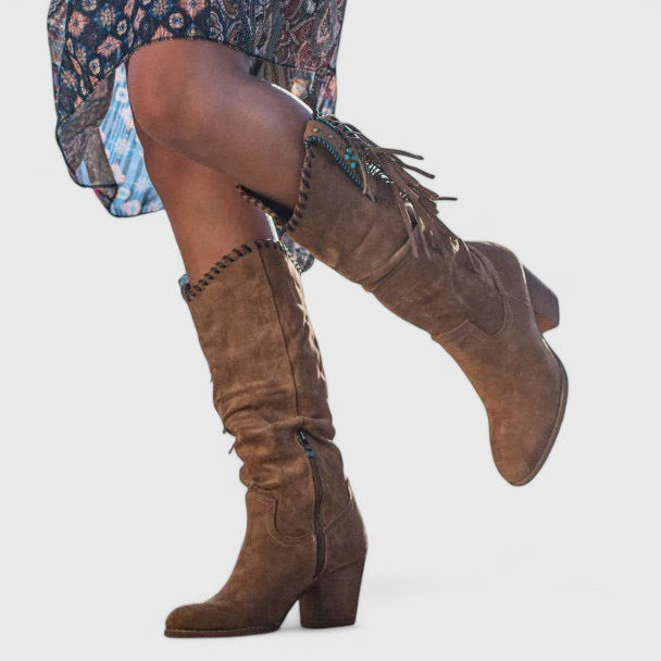 Fashionable women's mid-calf fringe boots with a stylish block heel. Perfect casual or winter footwear.
