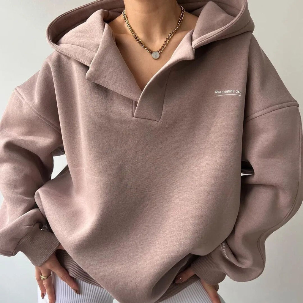 Stylish women's modern winter hoodie, a cozy long-sleeve pullover perfect for warm, casual everyday fashion.
