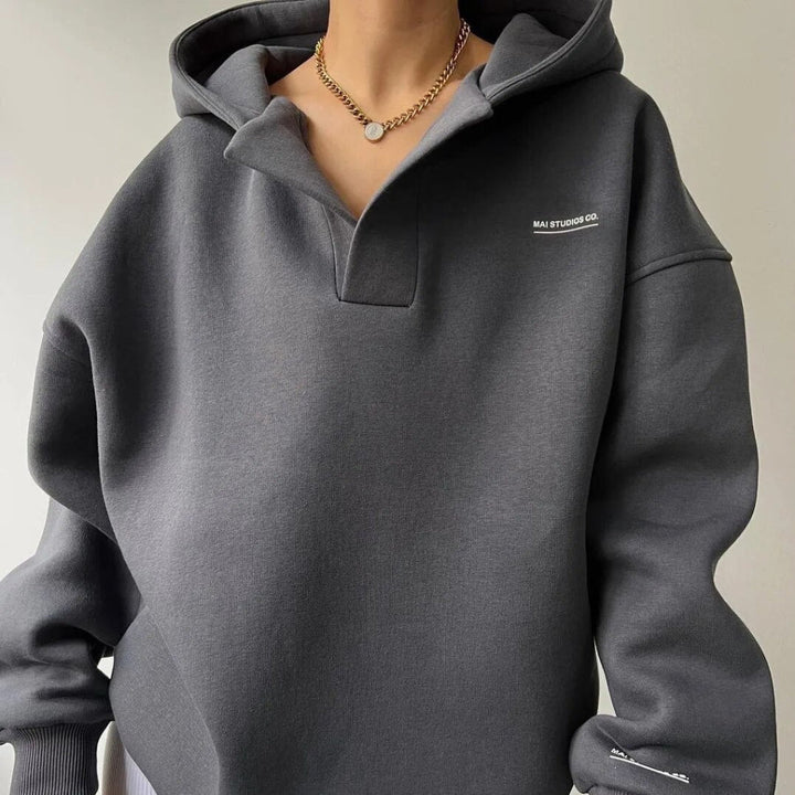 Comfortable women's winter hoodie, a warm long-sleeve pullover ideal for cozy layering and casual wear.