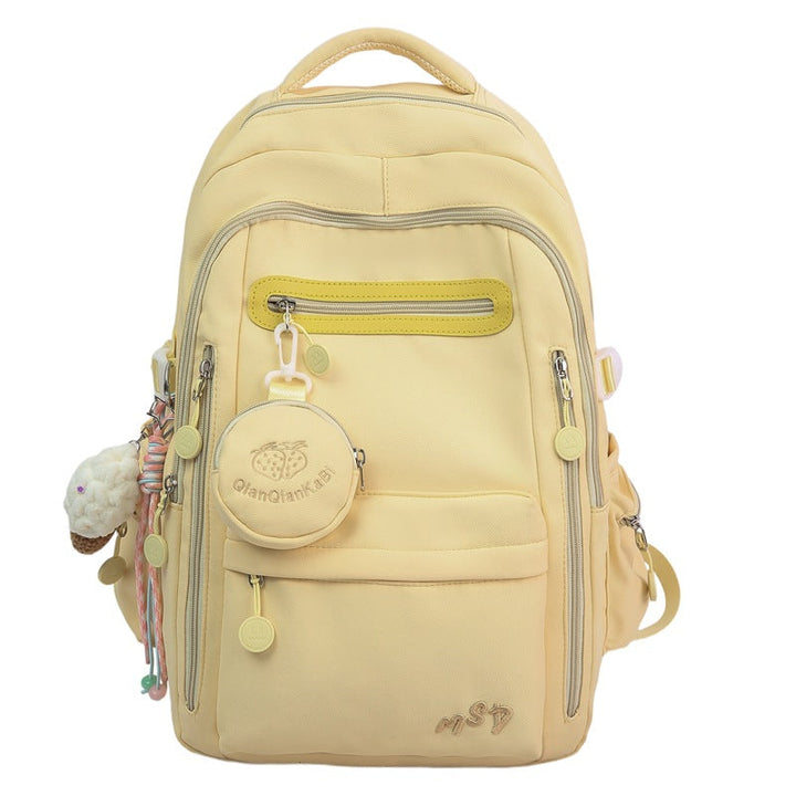 Women's travel backpack showcasing a padded laptop sleeve & multiple interior pockets for organization.