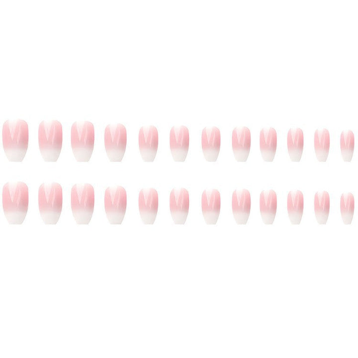 Close-up of women's trendy pink and white ombre press-on nails, showcasing the smooth gradient nail art design.
