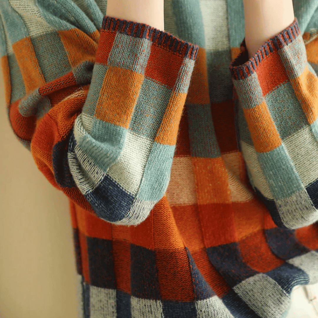 Elegant women's orange patchwork turtleneck sweater, a warm and stylish long-sleeve knit for cozy winter fashion.