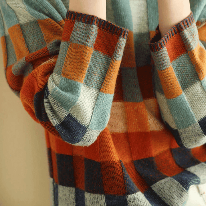 Elegant women's orange patchwork turtleneck sweater, a warm and stylish long-sleeve knit for cozy winter fashion.