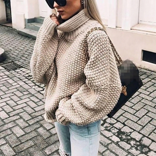 Cozy women's chunky knit turtleneck jumper. Chic oversized sweater for stylish winter & autumn comfort.