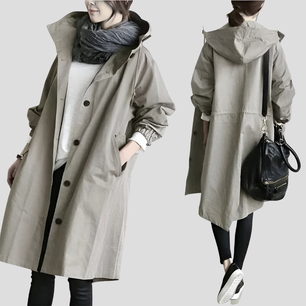 Stylish women's oversized raincoat with hood. Trendy, waterproof outerwear for all seasons. Lightweight fashion.