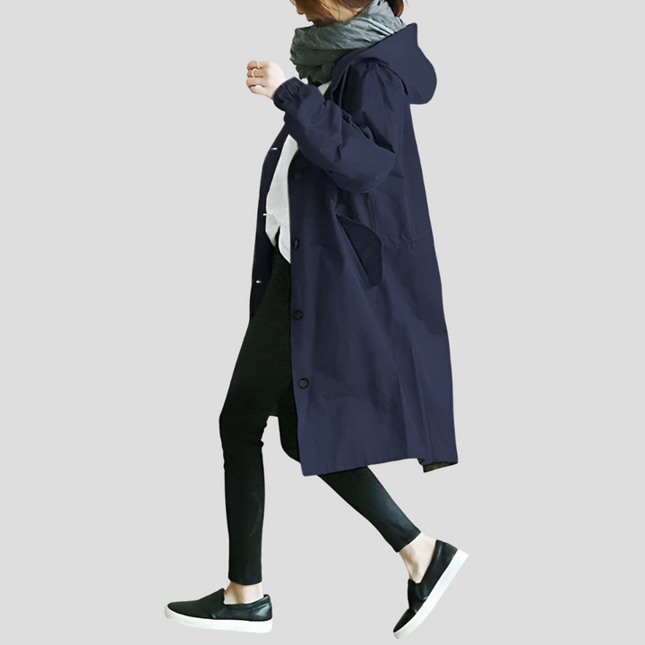 All-season women's oversized raincoat with hood. Stylish, waterproof and lightweight outerwear for trendy fashion.
