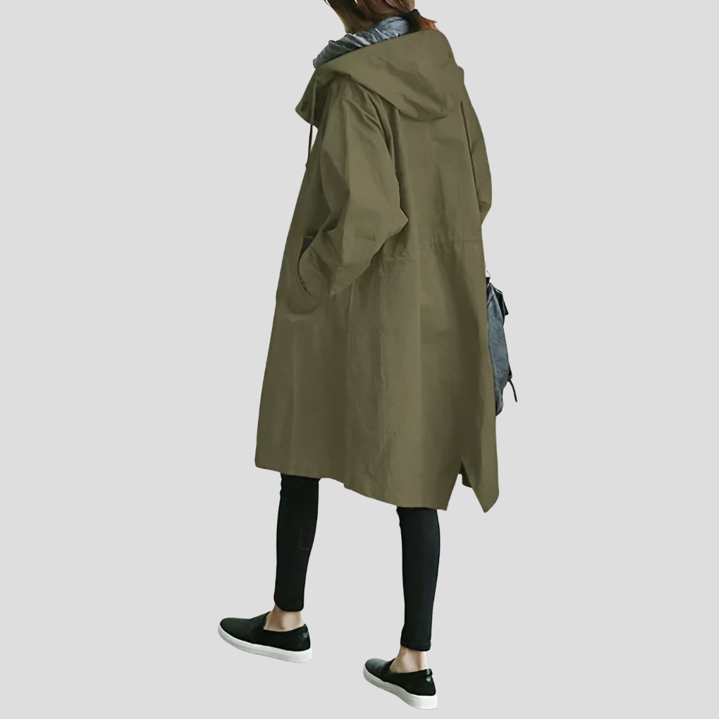 Trendy women's oversized hooded raincoat. Waterproof and lightweight outerwear, perfect for stylish all-season wear.