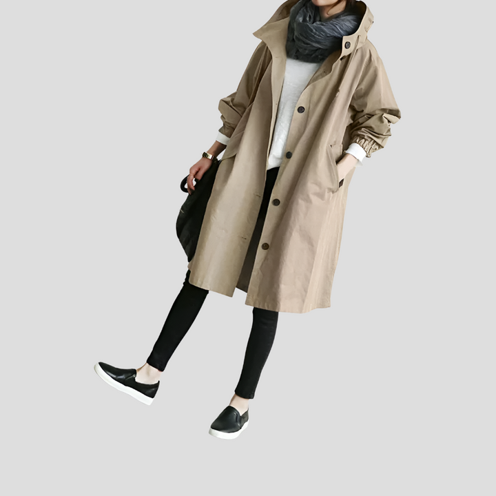 Stylish women's oversized rain jacket with hood. Modern, waterproof design for all-season fashion outerwear. Lightweight.