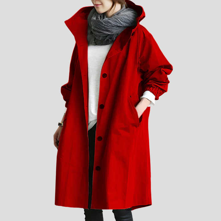 Fashionable women's oversized raincoat with hood. Waterproof, lightweight & trendy outerwear for a chic all-season look.