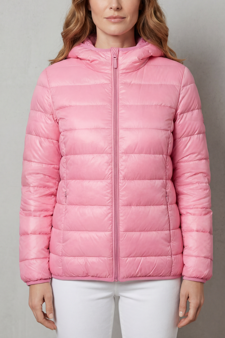 Stylish women's pink waterproof layering coat, perfect for all-weather protection & travel.