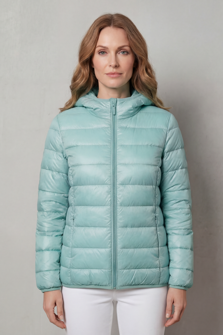 Durable waterproof women's all-weather coat, designed for effective layering in any weather.