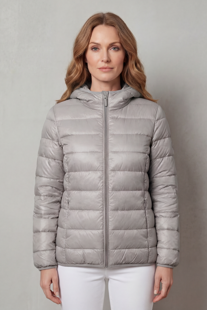 Vibrant pink waterproof women's layering coat, chic and ready for any weather.