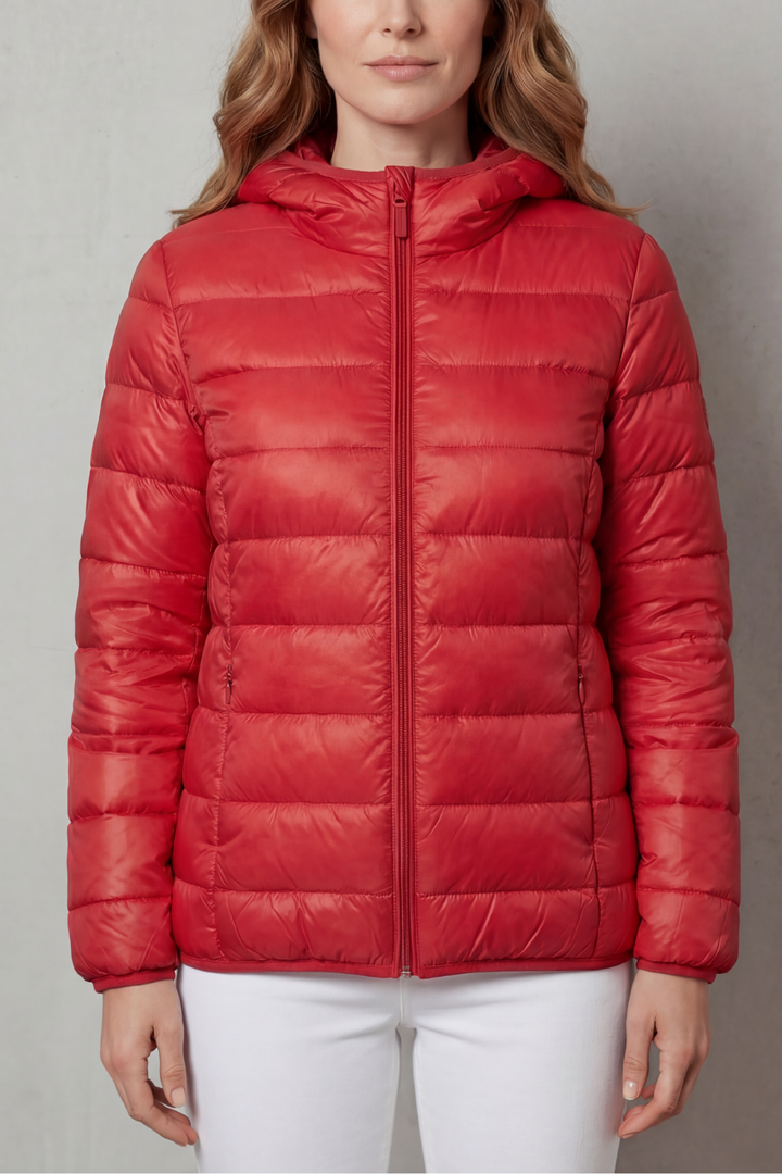 Lightweight & packable women's waterproof coat, perfect for travel and layering.