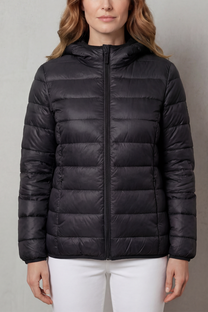 Front view of a pink women's waterproof all-weather layering coat.