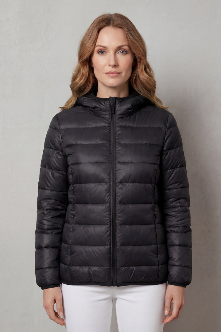 Side profile of a gray women's stylish waterproof rain jacket for layering.