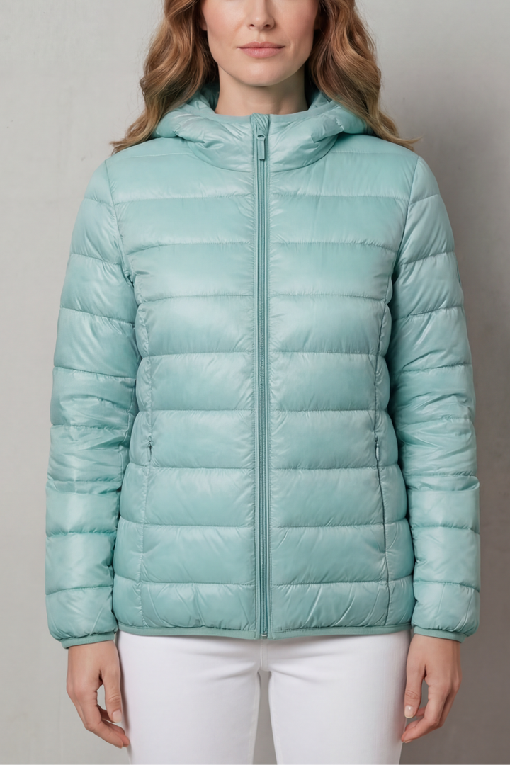 Back view of a packable black women's waterproof layering coat.