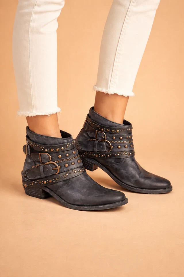 Women's sleek pointed cowboy boots. Modern western ankle boots with a low block heel, ideal for versatile fashion.