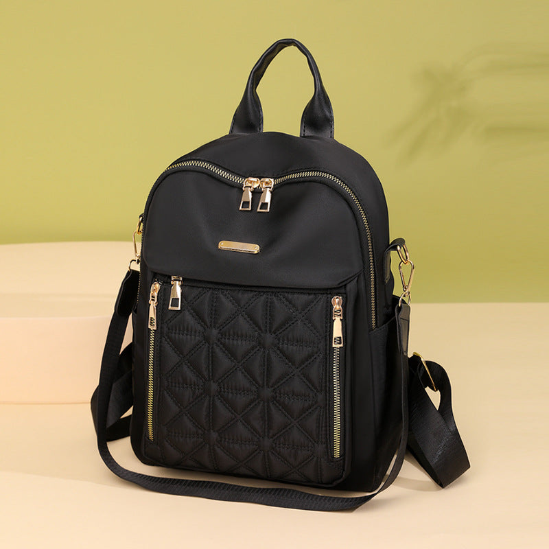 Stylish women's quilted backpack, a chic fashion accessory with multi-compartment design for daily use.