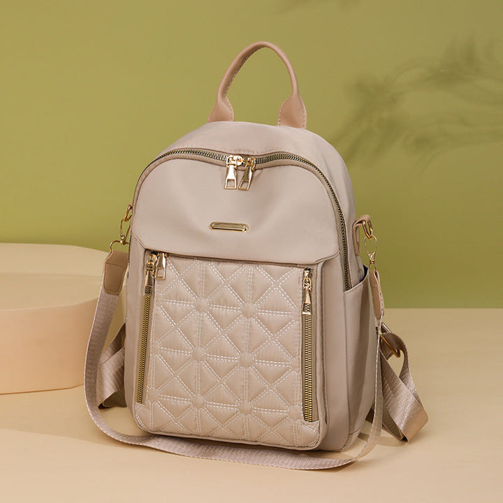 Versatile women's quilted travel bag, a modern multi-compartment backpack for fashion-conscious women.