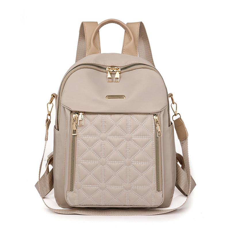 Elegant women's shoulder bag, quilted with multiple compartments, ideal for work and stylish outings.