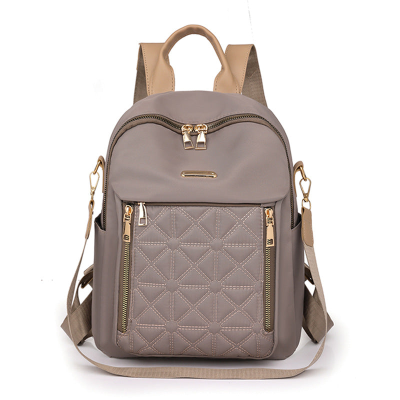 Practical women's quilted backpack with secure multi-compartment storage, great for school or daily commute.