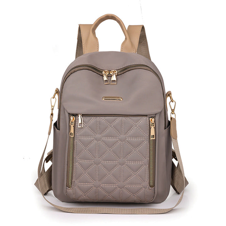 Practical women's quilted backpack with secure multi-compartment storage, great for school or daily commute.