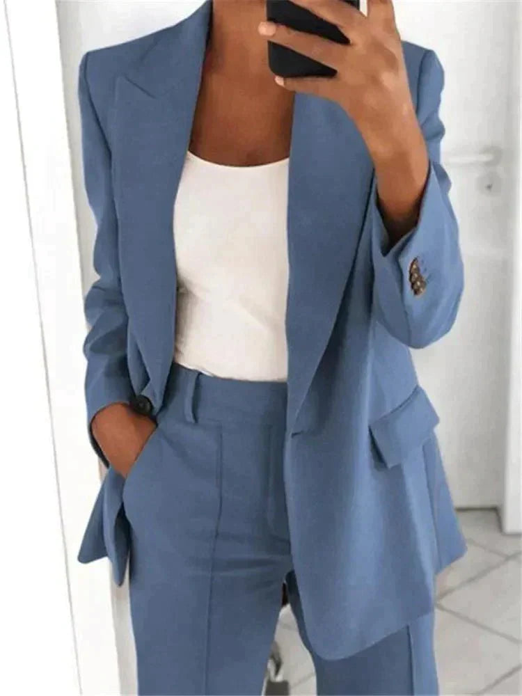 Stylish women's relaxed fit suit set, including a blazer and trousers, perfect for business casual or office wear.