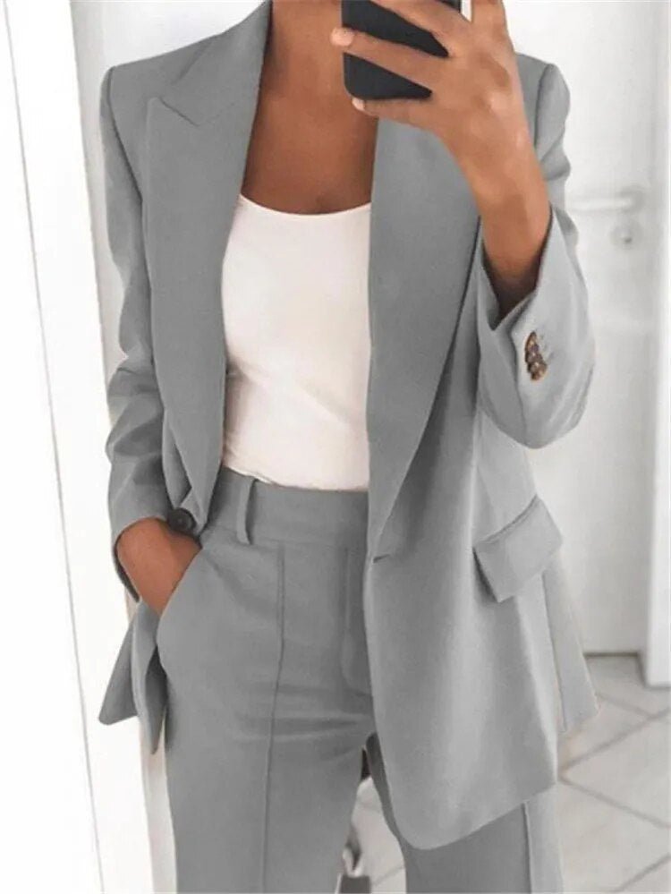 Comfortable women's business casual suit with a relaxed fit blazer and trousers, an elegant and professional two-piece.