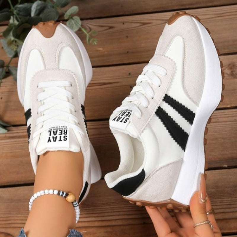 Pair of women's vintage style platform sneakers, offering trendy and comfortable footwear for any casual outfit.