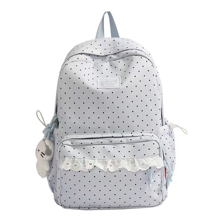 Women's ruffled polka dot school backpack with ample storage, ideal for daily use. Cute and chic accessory.