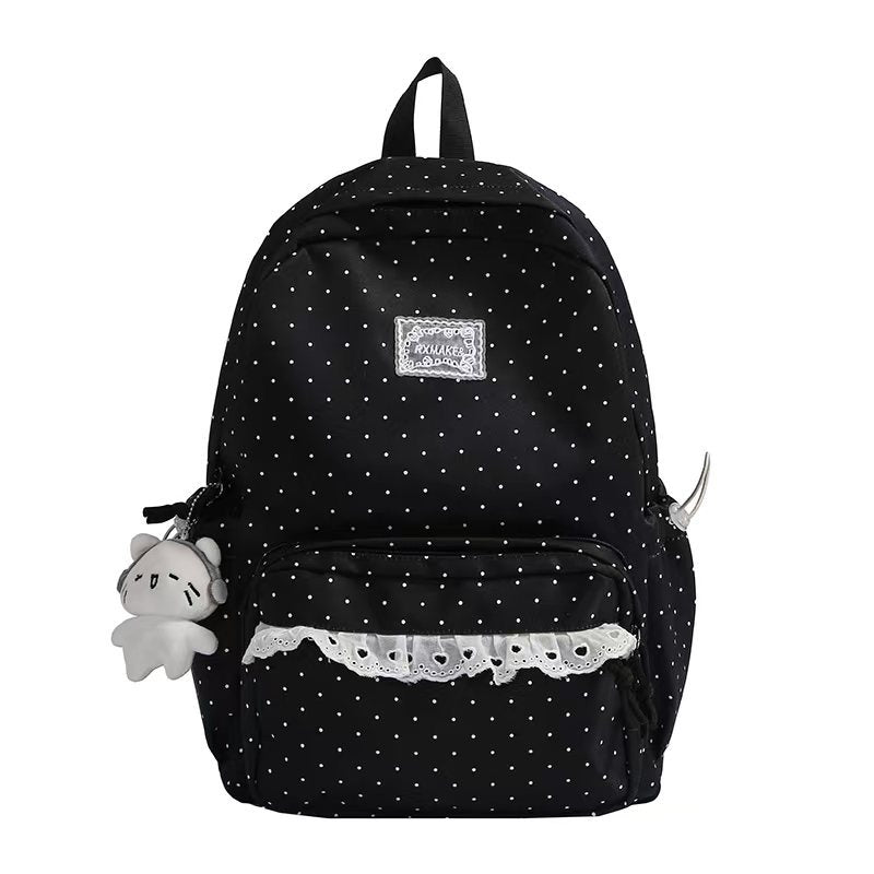 Cute women's ruffled polka dot backpack, a fashionable and practical school bag or travel accessory for women.