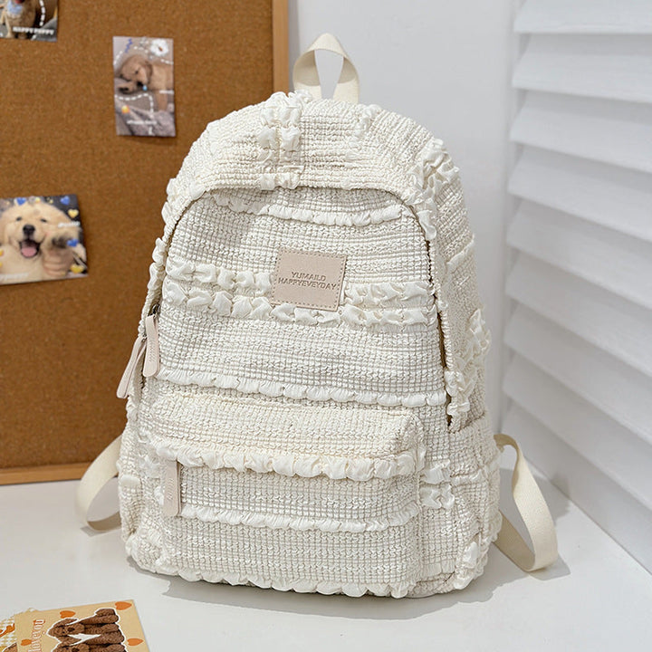 Stylish women's textured casual backpack in a durable design, perfect for everyday use.
