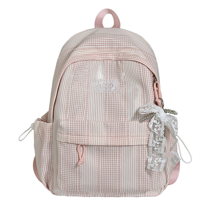 Stylish women's textured fashion backpack, perfect for daily use & travel. Modern design.