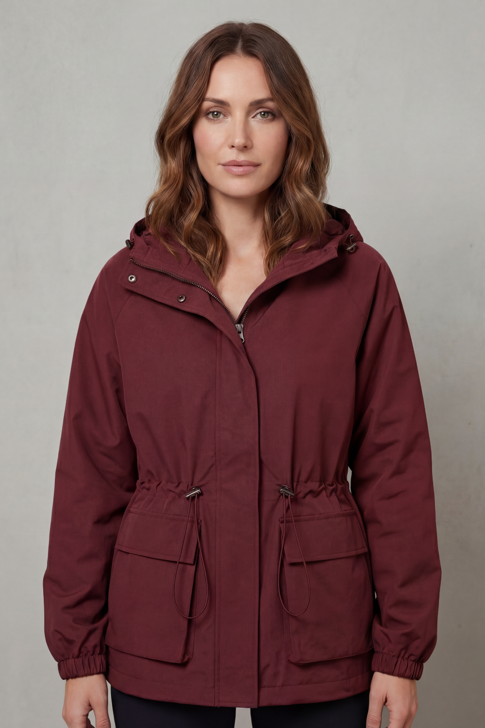 Stylish women's utility jacket, waterproof black design with drawstring, ideal for casual spring wear.