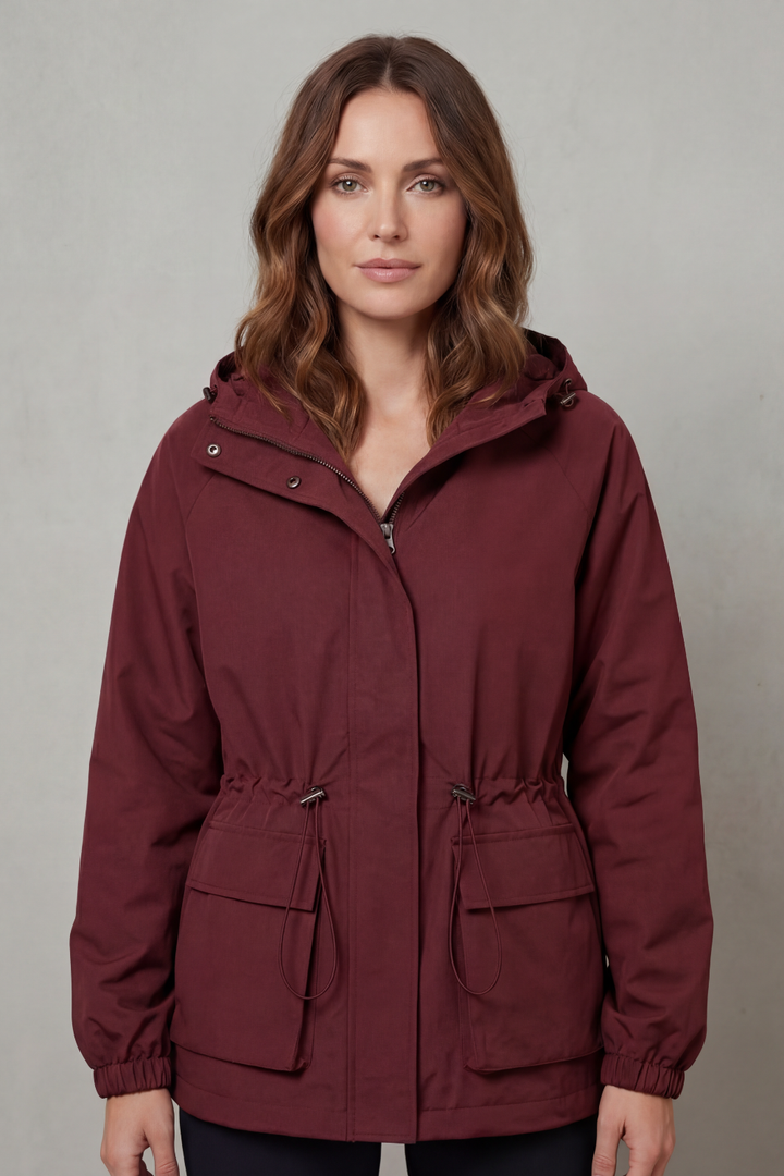 Stylish women's utility jacket, waterproof black design with drawstring, ideal for casual spring wear.
