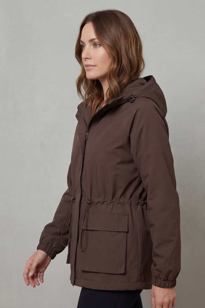 Black women's waterproof utility raincoat, stylish and lightweight, suitable for casual autumn outfits.