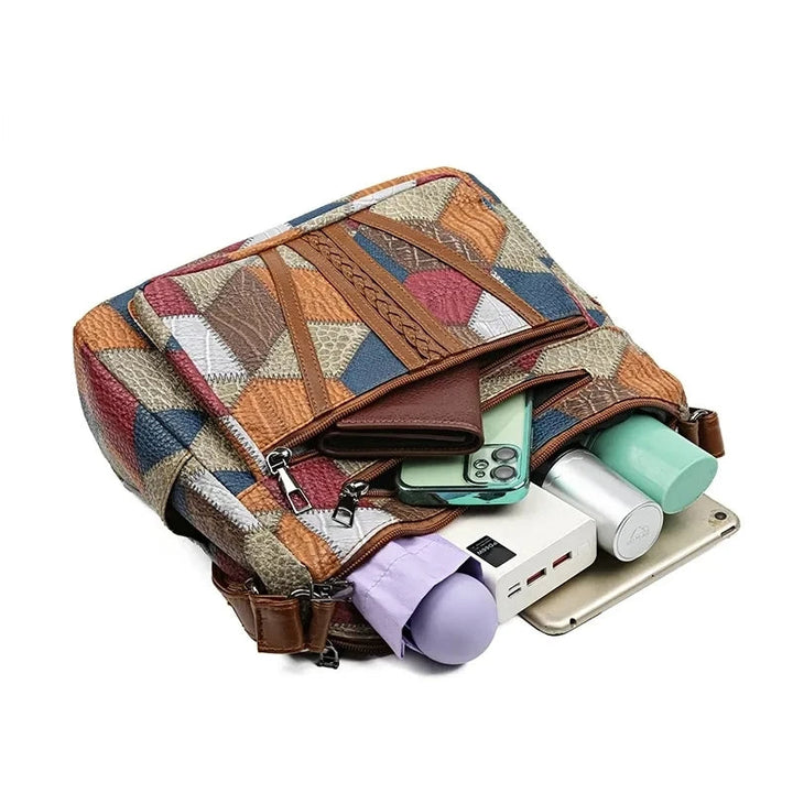 Contemporary women's stylish vegetable leather handbag. This versatile shoulder & crossbody bag elevates any outfit.
